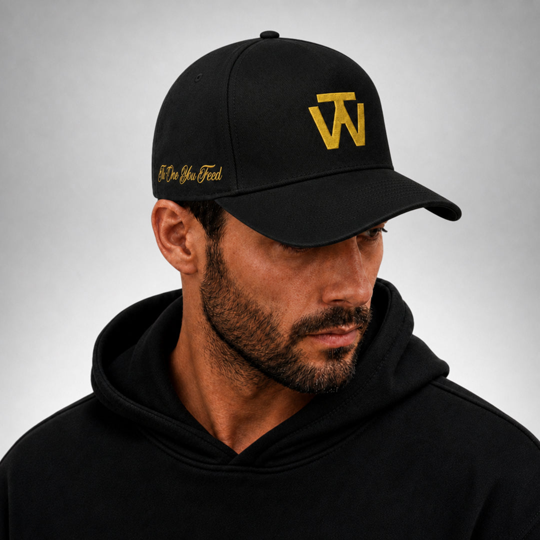 Black Two Wolves cap with gold embroidered logo worn by male model