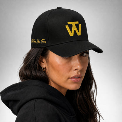Black Two Wolves cap with gold embroidered logo worn by female model