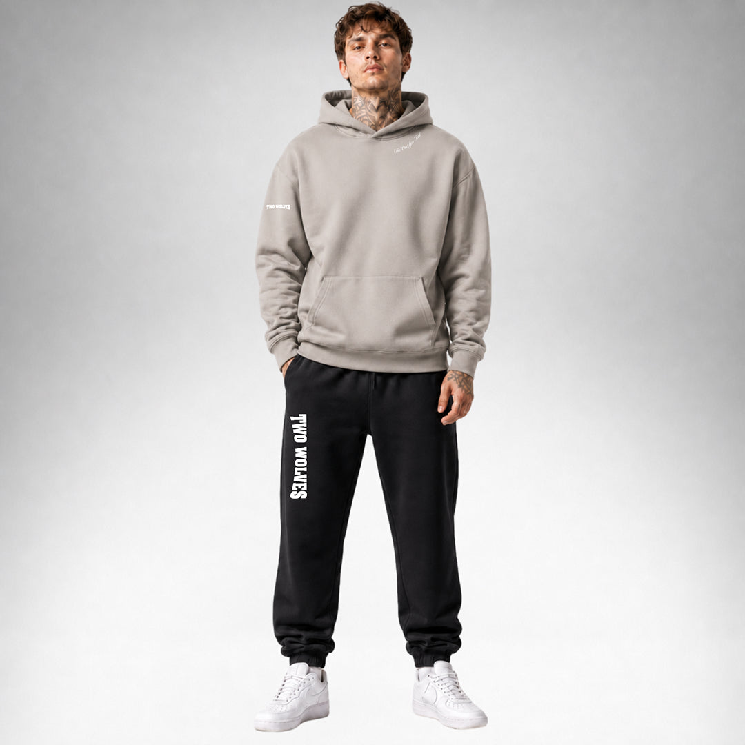 Mushroom Two Wolves Staple pullover hoodie shown from the front wearing by a male model.