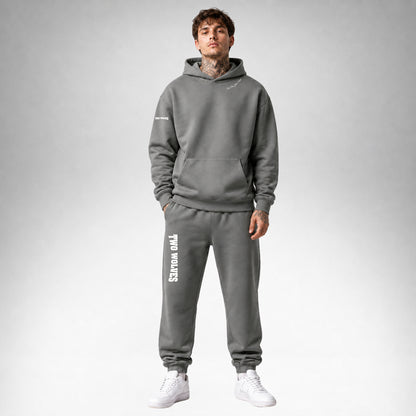 Shadow Two Wolves Staple pullover hoodie shown from the front wearing by a male model.