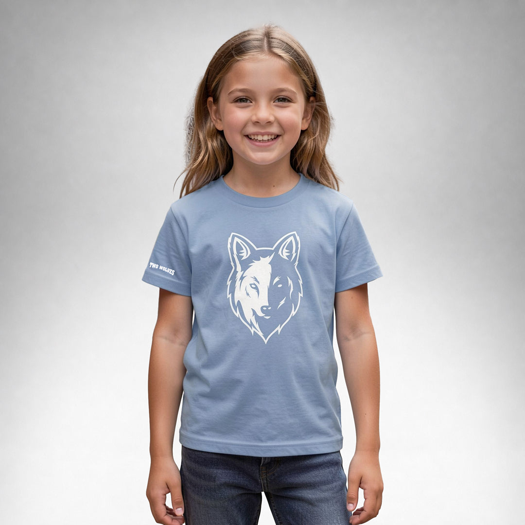 Girl wearing a blue Two Wolves Cub Staple T-shirt with a white wolf graphic on the front.