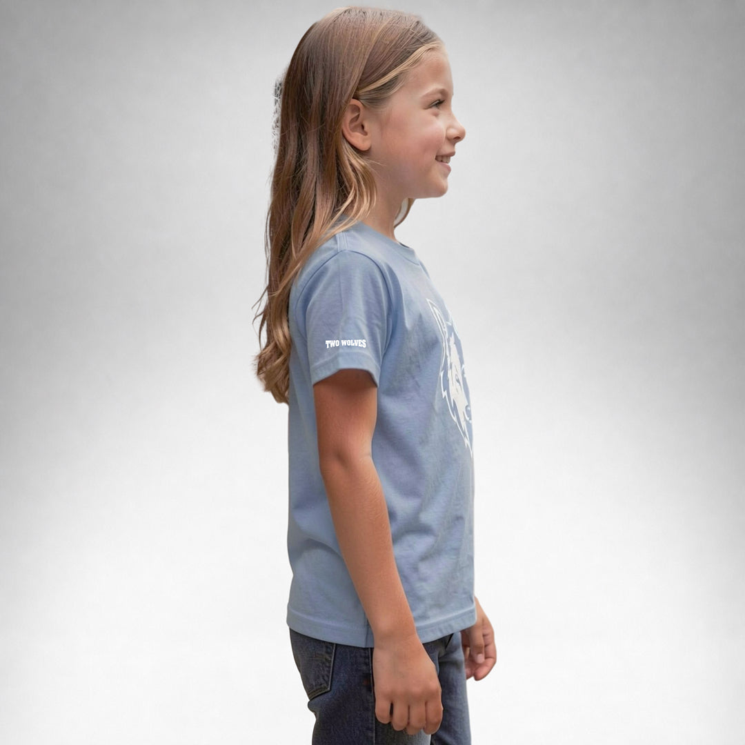 Girl wearing a blue Two Wolves Cub Staple T-shirt with a white wolf graphic, facing sideway.
