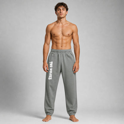 Shadow Two Wolves track pants with white logo on leg, worn by male model